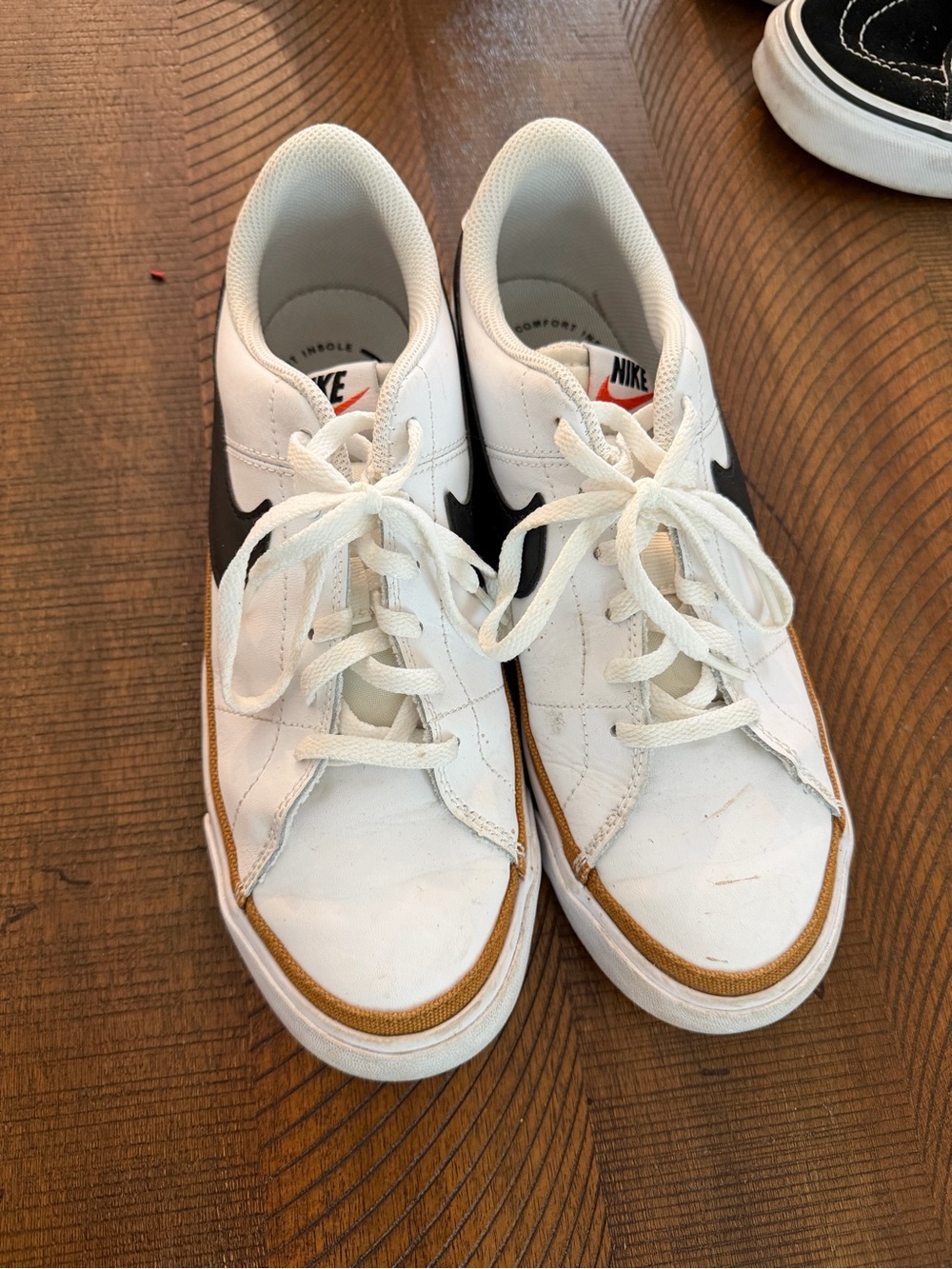 Nike Kids White Sneakers with Black Swoosh and Brown Trim
